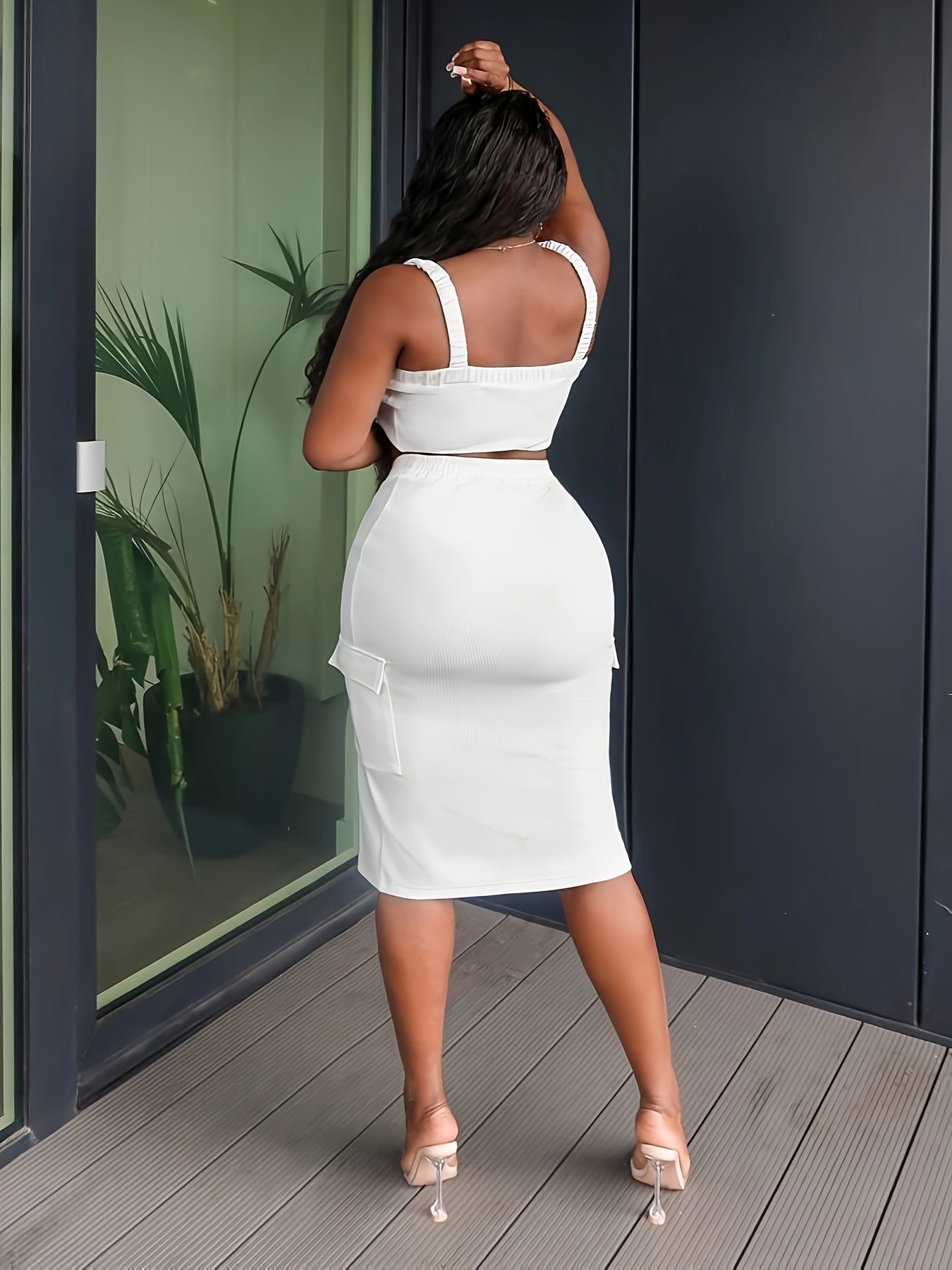 A Set Consisting of a Tank Top And a Split Skirt, Featuring Drawstring Pockets.